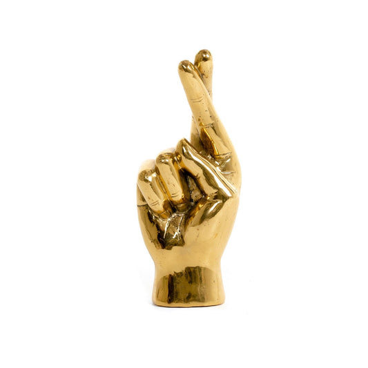 Incrociamo le dita, mano d'ottone