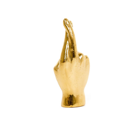 Incrociamo le dita, mano d'ottone